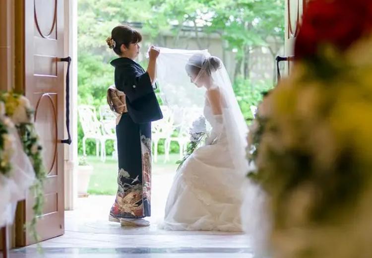 CLUB WEDDING(クラブ ウェディング/日本の宿 のと楽 ホテル能登倶楽部)。挙式会場。花嫁を災厄から守ると伝えられるベールダウンの儀式